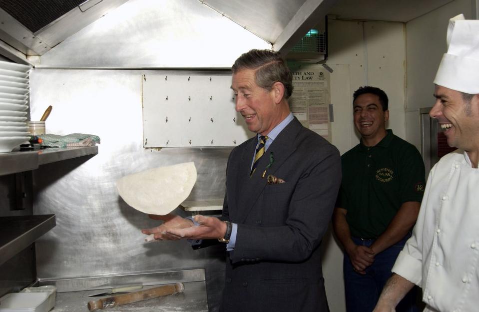<p>Who hasn't tried to master the pizza toss? Prince Charles gives it a shot at the Benvenuti Italian restaurant in Alnwick. </p>