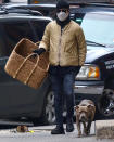 <p>Justin Theroux carries a huge basket while out in N.Y.C.'s West Village on Tuesday with his dog.</p>