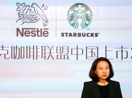 Starbucks China CEO Belinda Wong attends a news conference of Nestle start selling Starbucks-branded coffee in China, in Shanghai