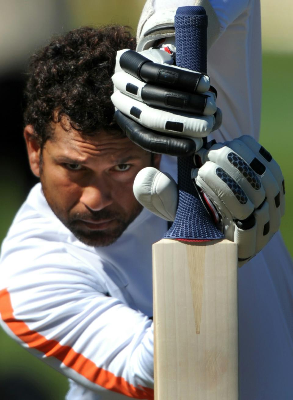 TO GO WITH AFP STORY BY KULDIP LAL Cricket-WC2011-IND-India-Tendulkar (FILES) This file photo taken on April 2, 2009 shows Indian cricketer Sachin Tendulkar practising his batting skills before the final Test between New Zealand and India, at the Basin Reserve stadium in Wellington. A billion hearts will beat for Sachin Tendulkar as he attemps to win the World Cup for India in his record-equalling sixth appearance in cricket's showpiece event. AFP PHOTO/Dibyangshu SARKAR (Photo credit should read DIBYANGSHU SARKAR/AFP/Getty Images)