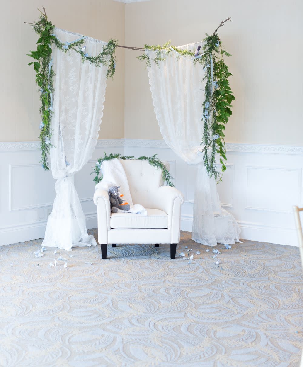 white curtains provide a pretty photo backdrop, a great baby shower idea