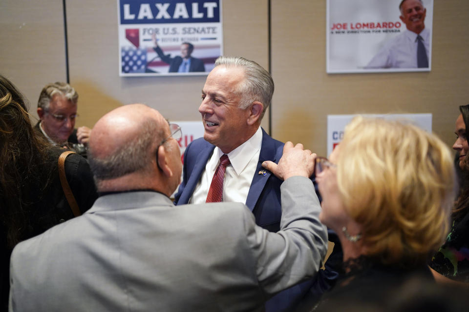 Clark County Sheriff Joe Lombardo, Republican candidate for governor of Nevada, greets supporters after speaking during an election night campaign event Tuesday, Nov. 8, 2022, in Las Vegas. (AP Photo/John Locher)