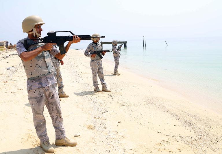 Members of Saudi border guard pose for pictures in the Ashiq island, in the southern Jizan province near the border with Yemen on April 1, 2015