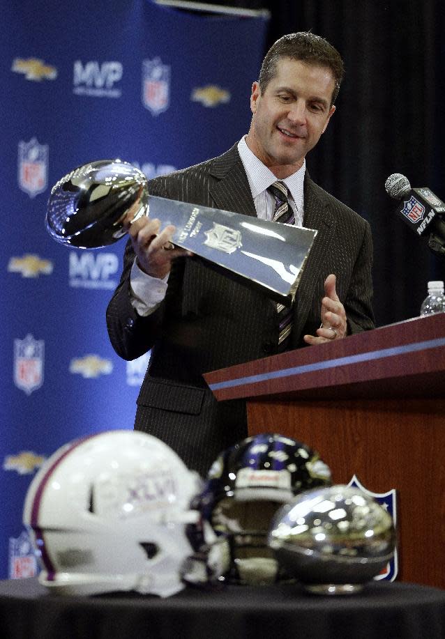 Baltimore Ravens head coach John Harbaugh holds the Vince Lombardi Trophy during a news conference after NFL Super Bowl XLVII football game Monday, Feb. 4, 2013, in New Orleans. The Ravens defeated the San Francisco 49ers 34-31.(AP Photo/Darron Cummings)