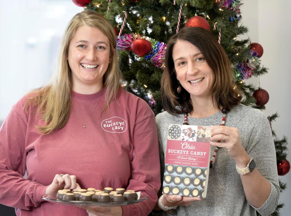 Alicia Hindman, owner of The Buckeye Lady, a dessert shop specializing in the peanut butter and chocolate confection, and Renee Casteel Cook, author of a new book, "Ohio Buckeye Candy: A Sweet History," at Hindman's store in Clintonville.