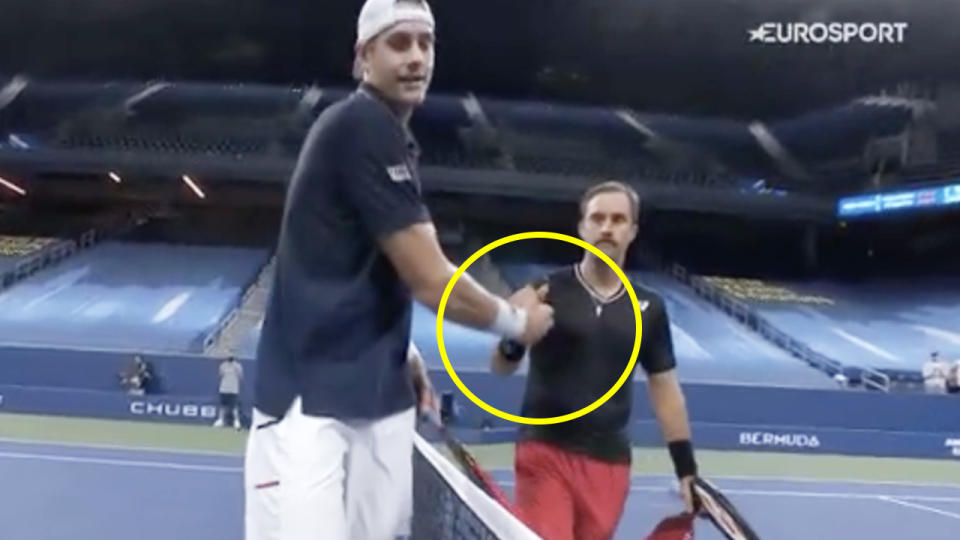 John Isner (pictured left) and Steve Johnson (pictured right) shake hands at the end of the match.