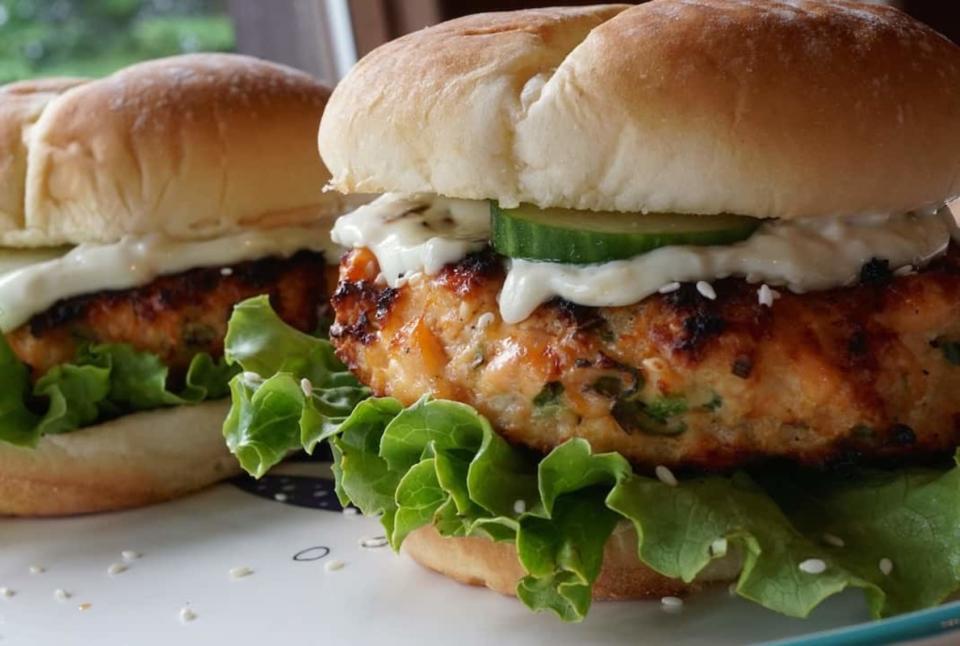 <p>Weekend at the Cottage</p><p>Handmade burgers flavored with ginger, green onion, jalapeño and panko topped with wasabi mayo.</p><p><strong>Get the recipe: <a href="https://weekendatthecottage.com/grilled-salmon-burgers/" rel="nofollow noopener" target="_blank" data-ylk="slk:Grilled Salmon Burgers;elm:context_link;itc:0;sec:content-canvas" class="link ">Grilled Salmon Burgers</a></strong></p>