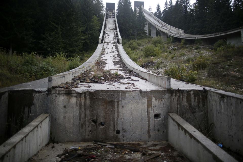 REFILE CORRECTING TYPO IN SARAJEVO A view of the disused ski jump from the Sarajevo 1984 Winter Olympics on Mount Igman, near Sarajevo September 19, 2013. Abandoned and left to crumble into oblivion, most of the 1984 Winter Olympic venues in Bosnia's capital Sarajevo have been reduced to rubble by neglect as much as the 1990s conflict that tore apart the former Yugoslavia. The bobsleigh and luge track at Mount Trebevic, the Mount Igman ski jumping course and accompanying objects are now decomposing into obscurity. The bobsleigh and luge track, which was also used for World Cup competitions after the Olympics, became a Bosnian-Serb artillery stronghold during the war and is nowadays a target of frequent vandalism. The clock is now ticking towards the 2014 Winter Olympics, with October 29 marking 100 days to the opening of the Games in the Russian city of Sochi. Picture taken on September 19, 2013. REUTERS/Dado Ruvic (BOSNIA AND HERZEGOVINA - Tags: SOCIETY SPORT OLYMPICS SKIING) ATTENTION EDITORS: PICTURE 17 OF 23 FOR PACKAGE 'SARAJEVO'S WINTER OLYMPIC LEGACY'. TO FIND ALL IMAGES SEARCH 'DADO IGMAN'