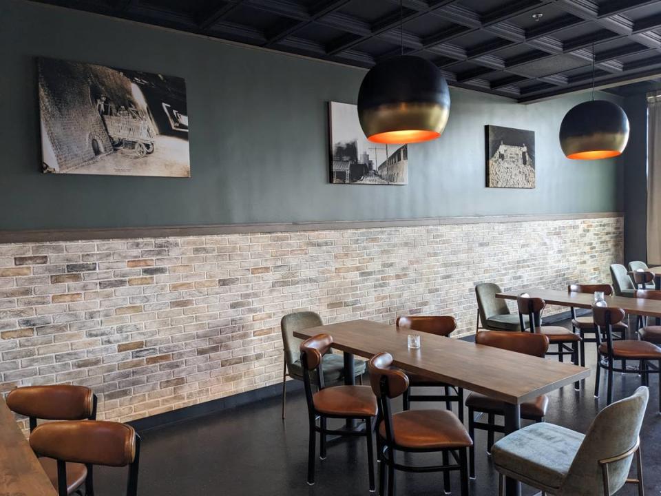 This part of the dining area at Brick + Bramble in Edwardsville features historic photos from the Richards Brick Company.