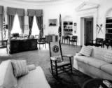 View of President John F. Kennedy’s rocking chair and desk (the H.M.S. Resolute desk) in the Oval Office, White House, Washington, D.C. (JFK Presidential Library)