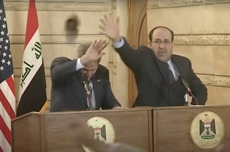 President Bush ducks from a shoe thrown by Muntazer al-Zaidia (AFP/YouTube)