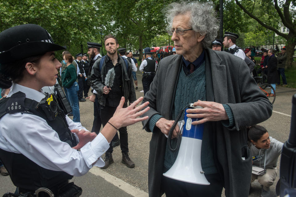 LONDON, ENGLAND - MAY 16: Piers Corbyn (brother of former Labour leader Jeremy Corbyn) is spoken to by the Police as conspiracy theorists gather at Hyde Park Corner to defy the emergency legislation and protest their claim that the Coronavirus pandemic is part of a secret conspiracy on May 16, 2020 in London, United Kingdom. The prime minister has announced the general contours of a phased exit from the current lockdown, adopted nearly two months ago in an effort curb the spread of Covid-19. (Photo by Guy Smallman/Getty images)