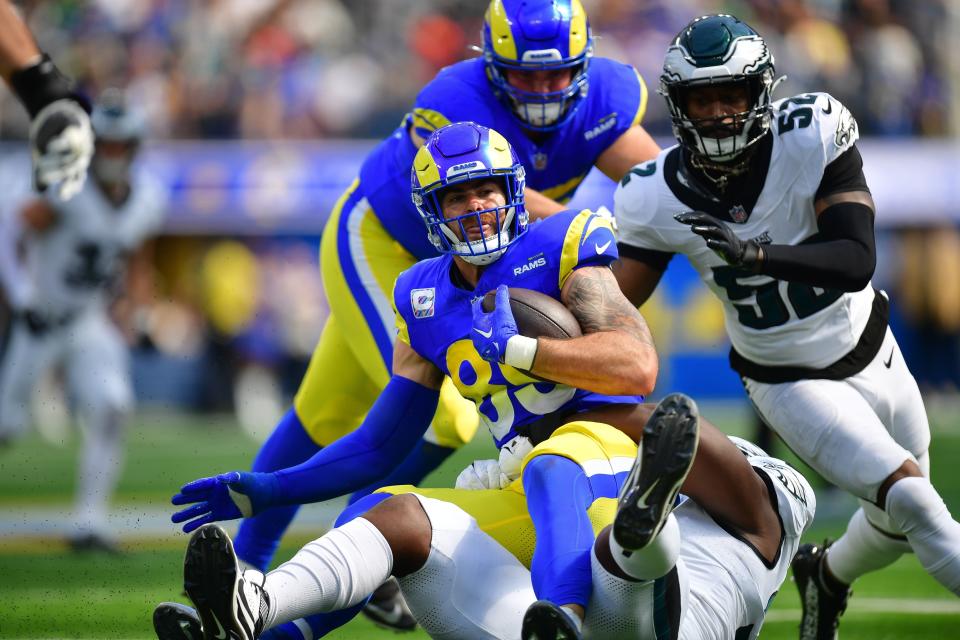 Oct 8, 2023; Inglewood, California, USA; Los Angeles Rams tight end Tyler Higbee (89) is brought down by Philadelphia Eagles defensive tackle Kentavius Street (97) during the first half at SoFi Stadium. Mandatory Credit: Gary A. Vasquez-USA TODAY Sports