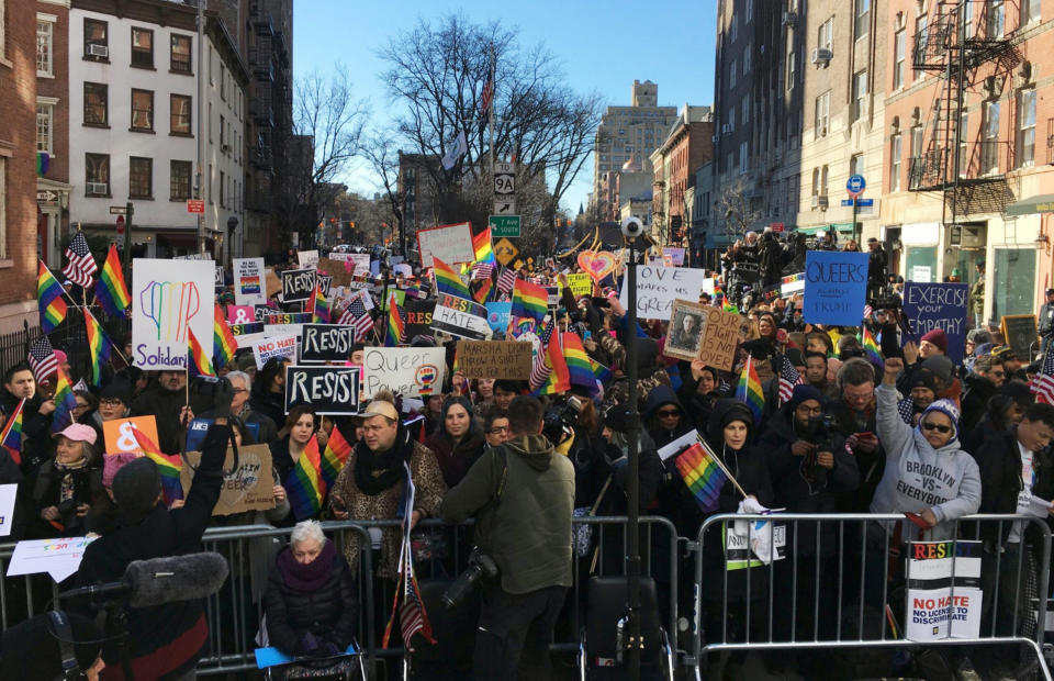 Protesters opposed to President Donald Trump's Immigration policy gather outside the Stonewall Inn, a Greenwich Village bar where the gay rights movement was born, Saturday, Feb. 4, 2017. One week before, the president issued an executive order barring people from seven mostly Muslim countries from the U.S. A judge temporarily blocked the ban Friday, allowing travelers to enter. (Karen Ciaramella via AP)