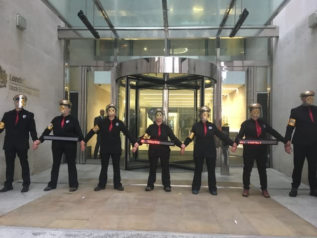 Environment protesters from Extinction Rebellion glue themselves to London Stock Exchange