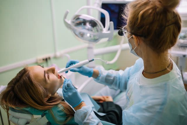 <p>Getty</p> Stock image of a dentist and patient