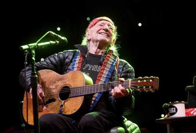 Willie Nelson inhales the love at 90th birthday concert