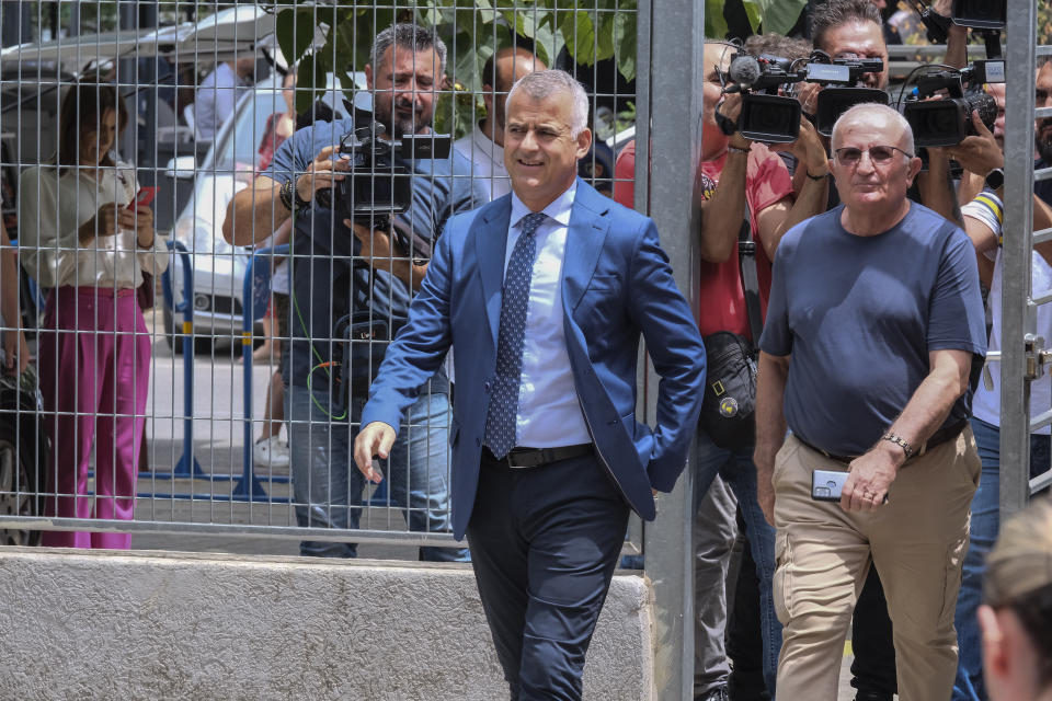 Vangjel Dule, the leader of the Unity for Human Rights Party, a party of ethnic Greek minority, left, arrives at the court in Tirana, Albania, on Tuesday, June 25, 2024. An Albanian appeals court on Tuesday upheld a two-year prison sentence for an elected mayor of the country's Greek minority, in a move expected to further exacerbate tension with neighboring Greece. The appeals court declined to change the verdict of the court of first instance in March on Dhionisios Alfred Beleris, 51, who was imprisoned on charges of vote-buying in municipal elections last year. (AP Photo/Vlasov Sulaj)