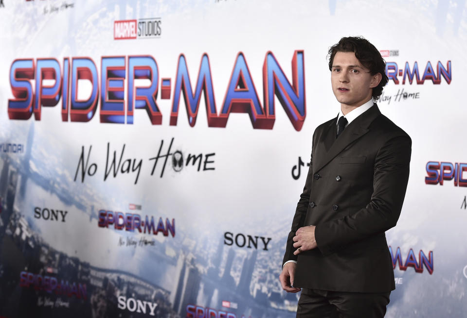 FILE - Tom Holland arrives at the premiere of "Spider-Man: No Way Home" at the Regency Village Theater on Monday, Dec. 13, 2021, in Los Angeles. “Spider-Man: No Way Home” has swung back on top of the box office during a holiday weekend where American theaters aimed to lure moviegoers with discounted $3 tickets. The first “National Cinema Day” nationwide promotion appeared to work with the highest-attended day of the year, drawing an estimated 8.1 million moviegoers on Saturday, Sept. 3, 2022, according to The Cinema Foundation. (Photo by Jordan Strauss/Invision/AP, File)