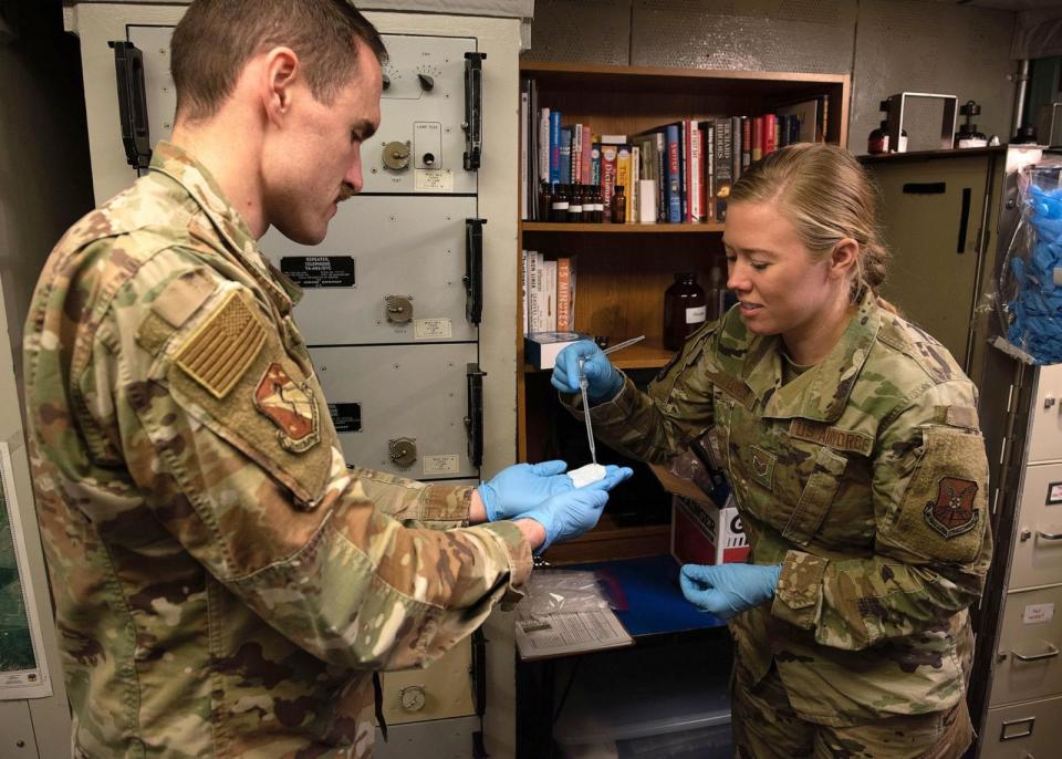 PHOTO: Bioenvironmental engineers Tech. Sgt. Quintin Labs, U.S. Air Force School of Aerospace Medicine and Staff Sgt. Jessika Ilgen, collect a swipe sample in a launch control center near Malmstrom Air Force Base, Mont., June 22, 2023.  (John Turner/U.S. Air Force)