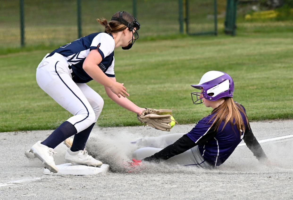 Paige Meda of Bourne arrives at third ahead of the tag by Willa Leighton of Monomoy.