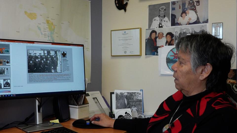 Geraldine Manson, VIU's Elder-in-Residence, at her desk, working on a video that showcases Snuneymuxw veterans and soldiers.