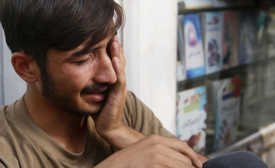 <p>An Afghan boy cries near the scene of an attack by the Islamic State militants targeting the Iraqi embassy in Kabul, Afghanistan, July 31, 2017. (Jawad Jalali/EPA/REX/Shutterstock) </p>