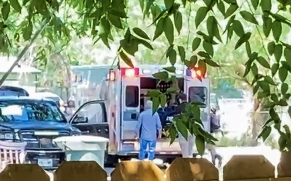 An image from social media appears to show a body being loaded onto an ambulance in Uvalde - REUTERS