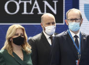 Slovakia's President Zuzana Caputova, left, arrives for a NATO summit at NATO headquarters in Brussels, Monday, June 14, 2021. U.S. President Joe Biden is taking part in his first NATO summit, where the 30-nation alliance hopes to reaffirm its unity and discuss increasingly tense relations with China and Russia, as the organization pulls its troops out after 18 years in Afghanistan. (Kenzo Tribouillard, Pool via AP)