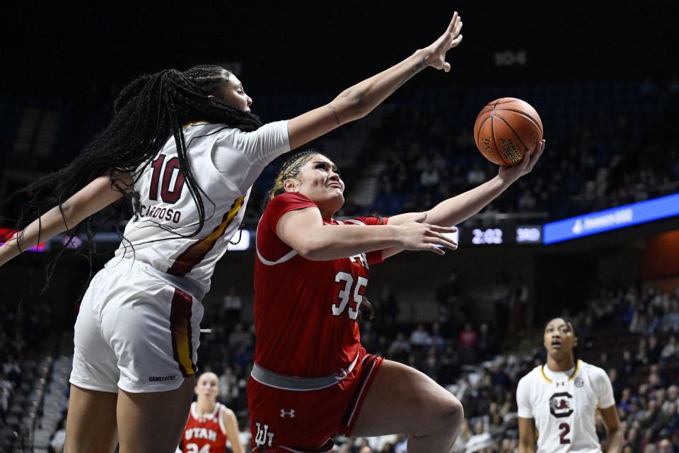 Utah forward Alissa Pili (35) shoots as South Carolina center Kamilla Cardoso (10) defends in the second half of an NCAA college basketball game, Sunday, Dec. 10, 2023, in Uncasville, Conn. | Jessica Hill, Associated Press