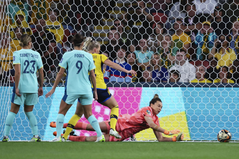 Australia's goalkeeper Mackenzie Arnold dives to make a save during the Women's World Cup third place playoff soccer match between Australia and Sweden in Brisbane, Australia, Saturday, Aug. 19, 2023. (AP Photo/Tertius Pickard)