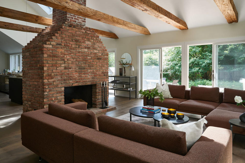 The living room with a woodburning fireplace. JUDY PAK STUDIO