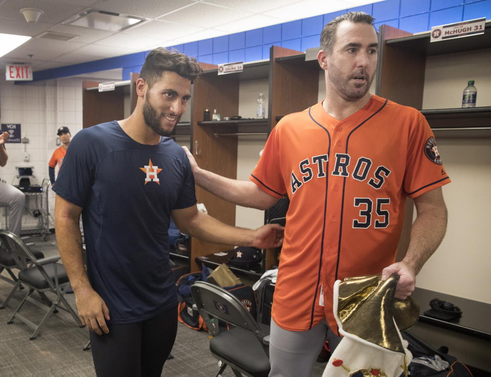 Houston Astros starting pitcher Justin Verlander, right, celebrates in the clubhouse with teammate Abraham Toro after they defeated the Toronto Blue Jays in a baseball game in Toronto, Sunday Sept. 1, 2019. Verlander pitched a no-hitter and Toro hit a go-ahead two-run home run in the ninth. (Fred Thornhill/The Canadian Press via AP)