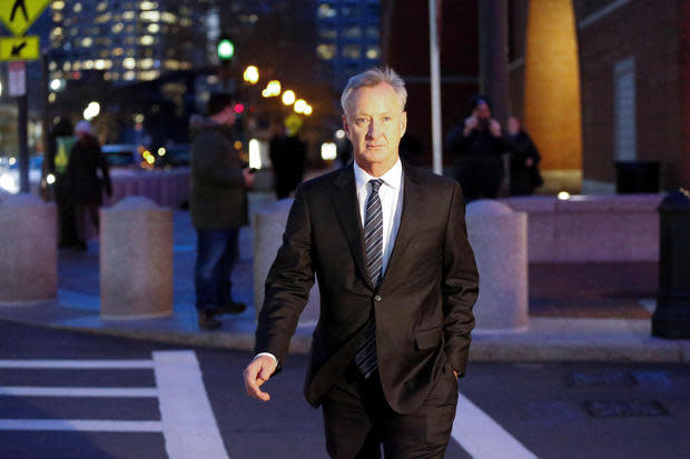 Title insurance executive Toby MacFarlane leaves the federal courthouse in Boston 