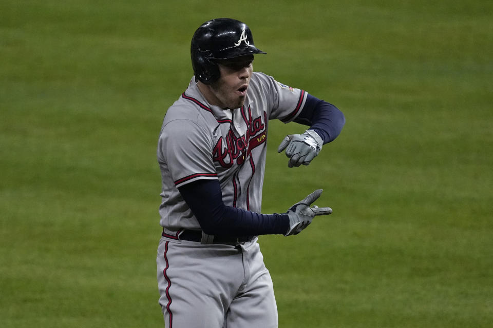 Atlanta Braves' Freddie Freeman celebrates after a home run during the seventh inning in Game 6 of baseball's World Series between the Houston Astros and the Atlanta Braves Tuesday, Nov. 2, 2021, in Houston. (AP Photo/Ashley Landis)