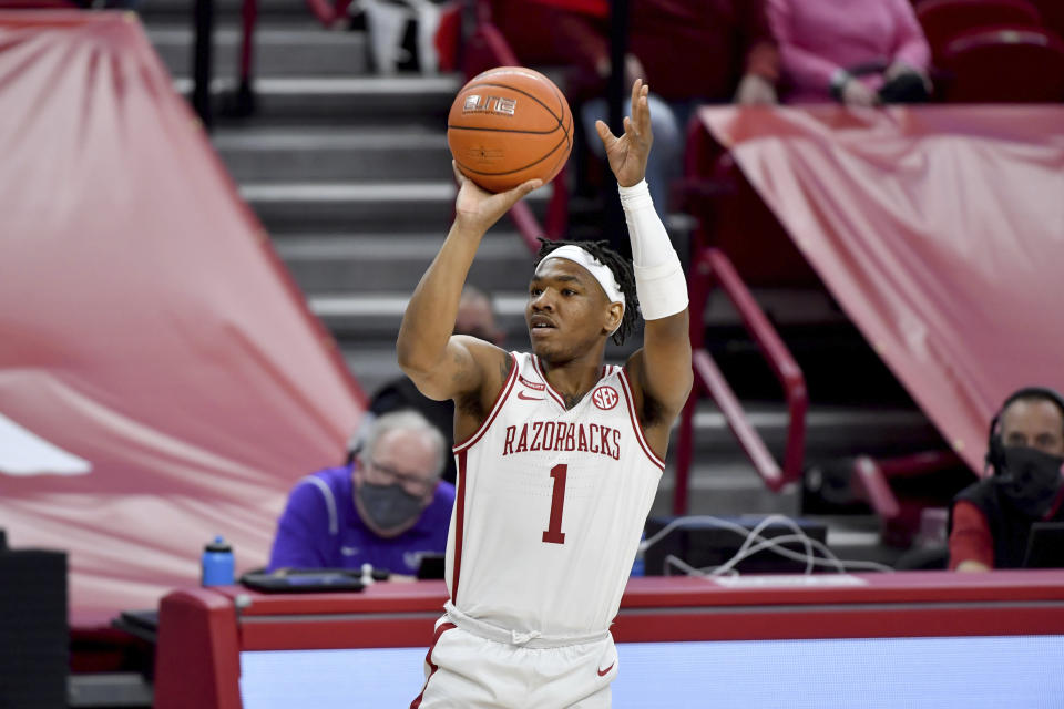 FILE - Arkansas guard JD Notae (1) shoots against LSU during the first half of an NCAA college basketball game in Fayetteville, Ark., in this Saturday, Feb. 27, 2021, file photo. The Razorbacks won nine of its last 10 games before the NCAA Tournament last season and advanced to the Elite Eight. The Razorbacks enter this season ranked 16th. J.D. Notae returns to lead the way. (AP Photo/Michael Woods, File)