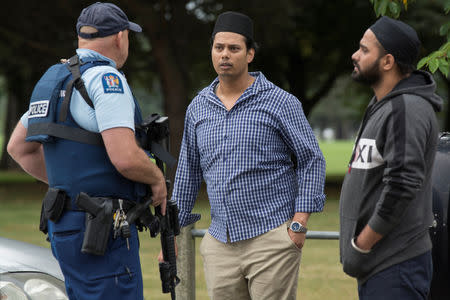 Witnesses and police at the south end of Deans Avenue after a shooting incident at the Al Noor mosque in Christchurch, New Zealand, March 15, 2019. REUTERS/SNPA/David Alexander