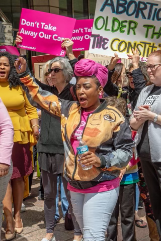 Rhiannon Carnes, co-founder of the Ohio Women's Alliance, pictured at a rally in 2019 after the 'heartbeat' abortion ban law was signed by Gov. Mike DeWine.