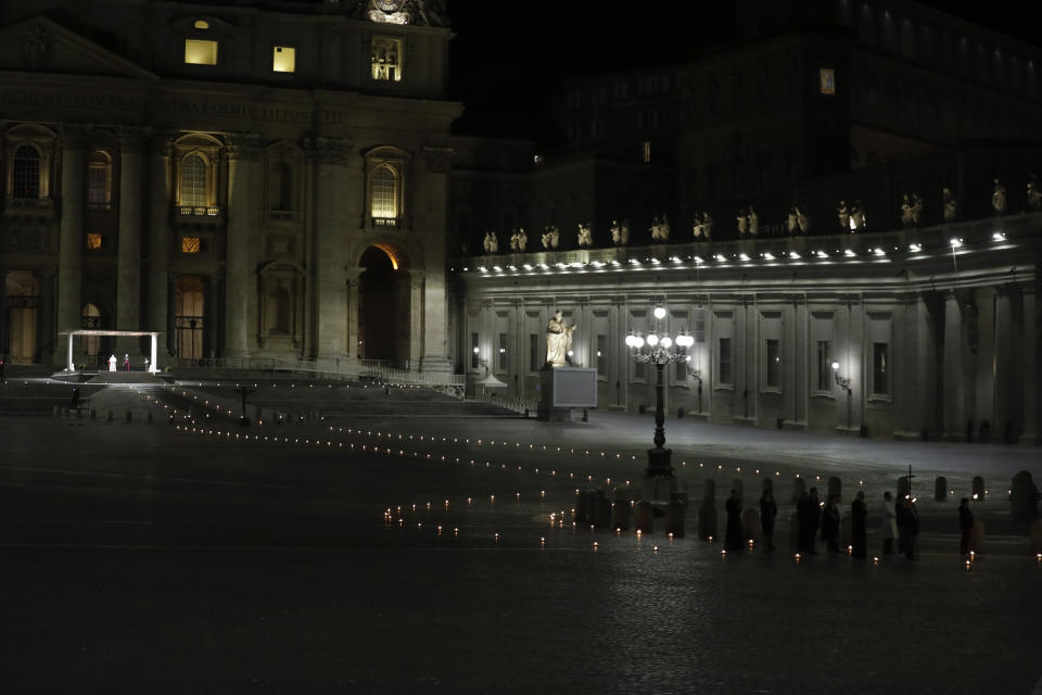 Pope Francis leads the Via Crucis – or Way of the Cross – ceremony in front of St. Peter's Basilica, empty of the faithful following Italy's ban on gatherings during a national lockdown to contain contagion, at the Vatican, Friday, April 10, 2020. (AP Photo/Andrew Medichini, Pool)
