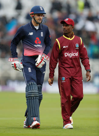 Cricket - England vs West Indies - Second One Day International - Trent Bridge, Nottingham, Britain - September 21, 2017 England's Alex Hales and West Indies' Jason Mohammed walk off as rain stops play Action Images via Reuters/Andrew Boyers