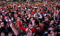 Chilean soccer fans react after winning the Copa America 2015 final soccer match between Chile and Argentina at a fan fest in Santiago, Chile, July 4, 2015. REUTERS/Mariana Bazo