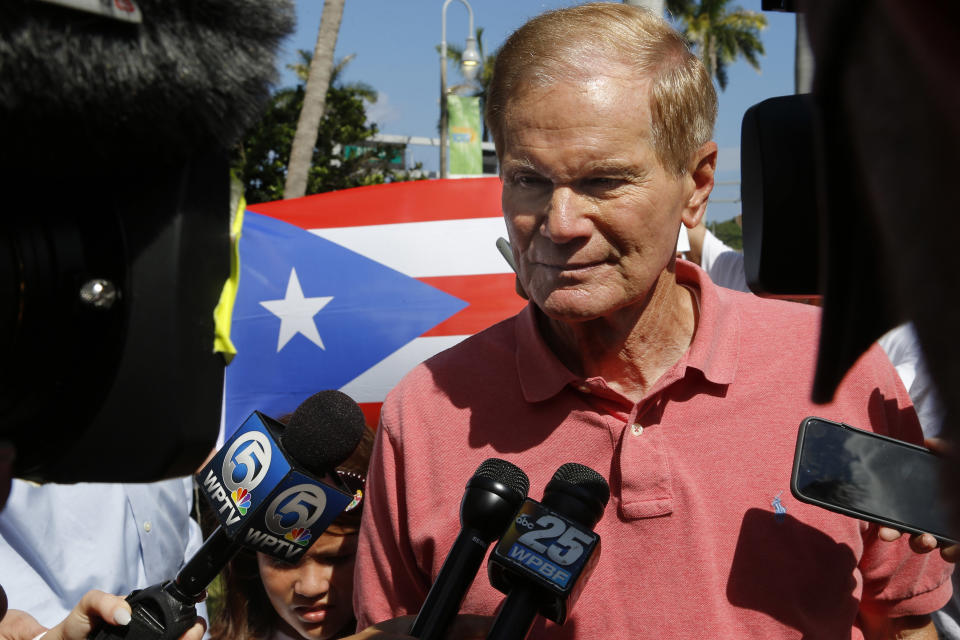 U.S. Sen. Bill Nelson, D-Fla., speaks to reporters at a rally in West Palm Beach, Fla., on Saturday, Sept. 22, 2018, marking the one-year anniversary of Hurricane Maria's devastation of Puerto Rico. (AP Photo/Ellis Rua)