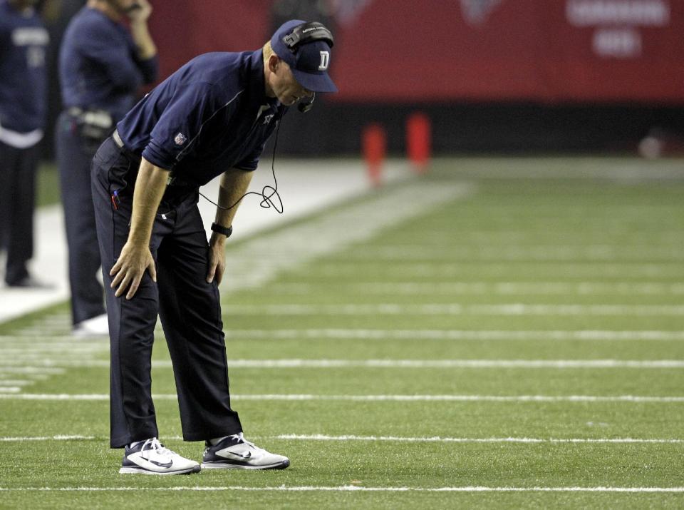 Dallas Cowboys head coach Jason Garrett reacts during the second half of an NFL football game against the Atlanta Falcons in Atlanta, Sunday, Nov. 4, 2012. Atlanta won 19-13. (AP Photo/Chuck Burton)