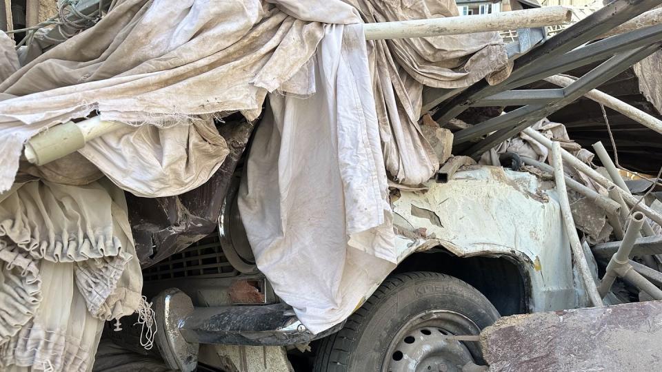 a car with a tarp over it