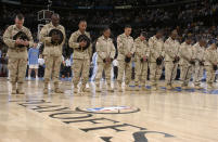 Members of the U.S. Military spend a moment of silence remembering fallen Army Ranger and Former NFL player Pat Tillman before the Denver Nuggets against the Minnesota Timberwolves in Game four of the Western Conference Quarterfinals during the 2004 NBA Playoffs April 27, 2004 at Pepsi Center in Denver, Colorado. (Photo by Garrett W. Ellwood/NBAE via Getty Images)