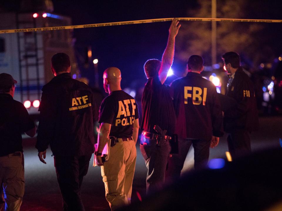 Police and FBI investigators at a cordon near the site of an explosion in south-west Austin: REUTERS