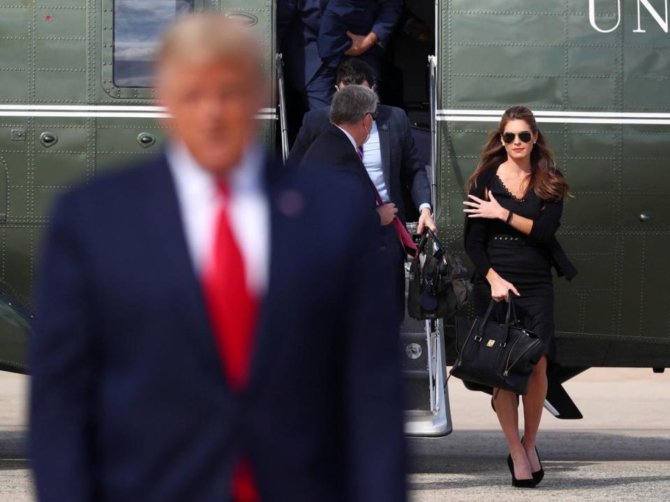 Hope Hicks walks from Marine One prior to boarding Air Force One as she departs Washington with then-President Donald Trump on 23 October 2020 (REUTERS)