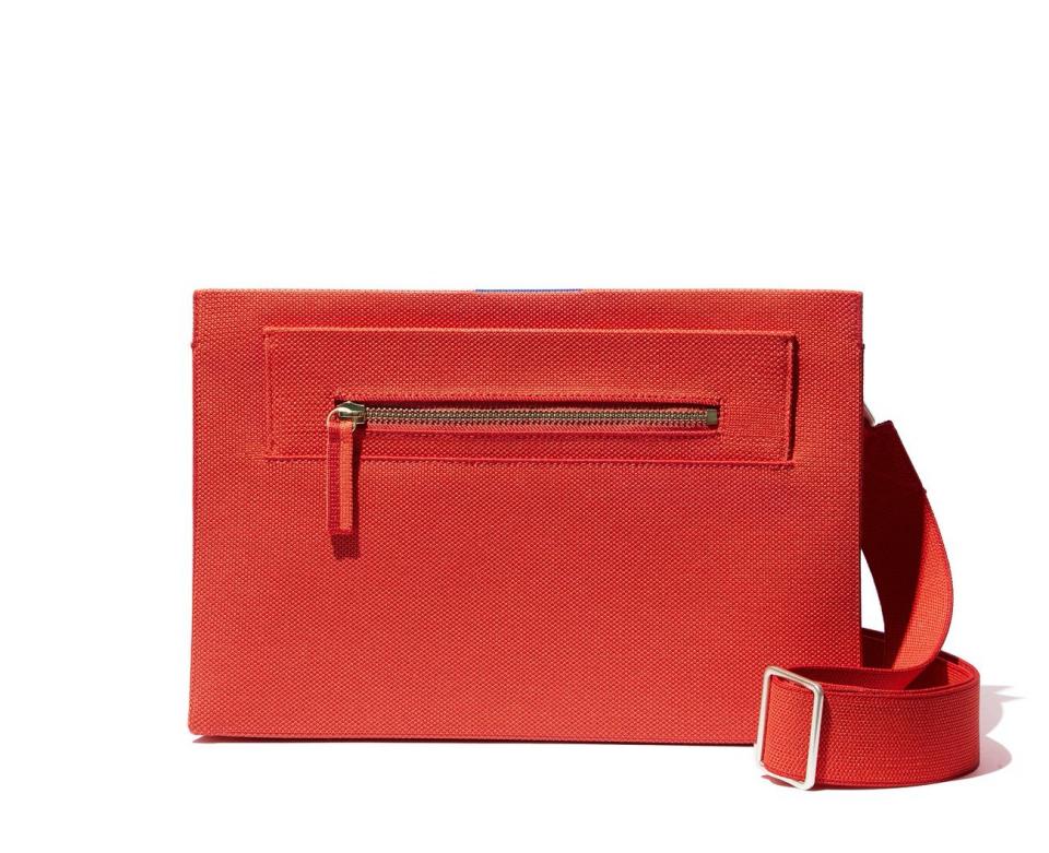 The Dual-Zip Crossbody in poppy red.