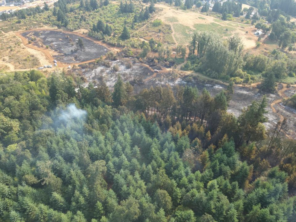 Smoke lingers the morning after the Liberty Fire not far from where the blaze is believed to have started just south of Salem, Oregon. This still image shot by a Salem Police Department drone pilot is of a view to the northeast.