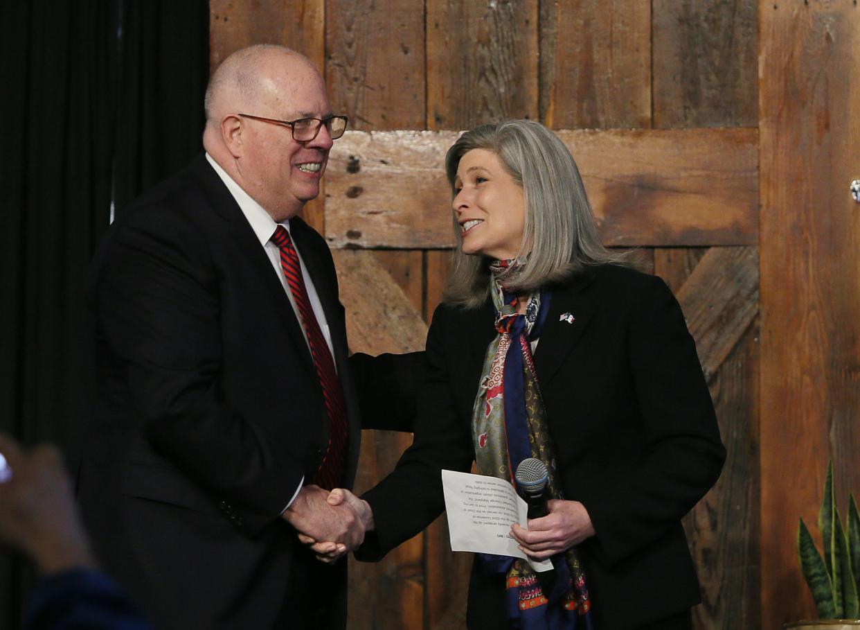 In this file photo, Former Maryland Gov. Larry Hogan gets greeted by U.S. Senator Joni Ernst during a panel discussion about America’s strength and leadership abroad and its importance organized by The Bastion Institute at The River Center on March 18, 2023, in Des Moines, Iowa.